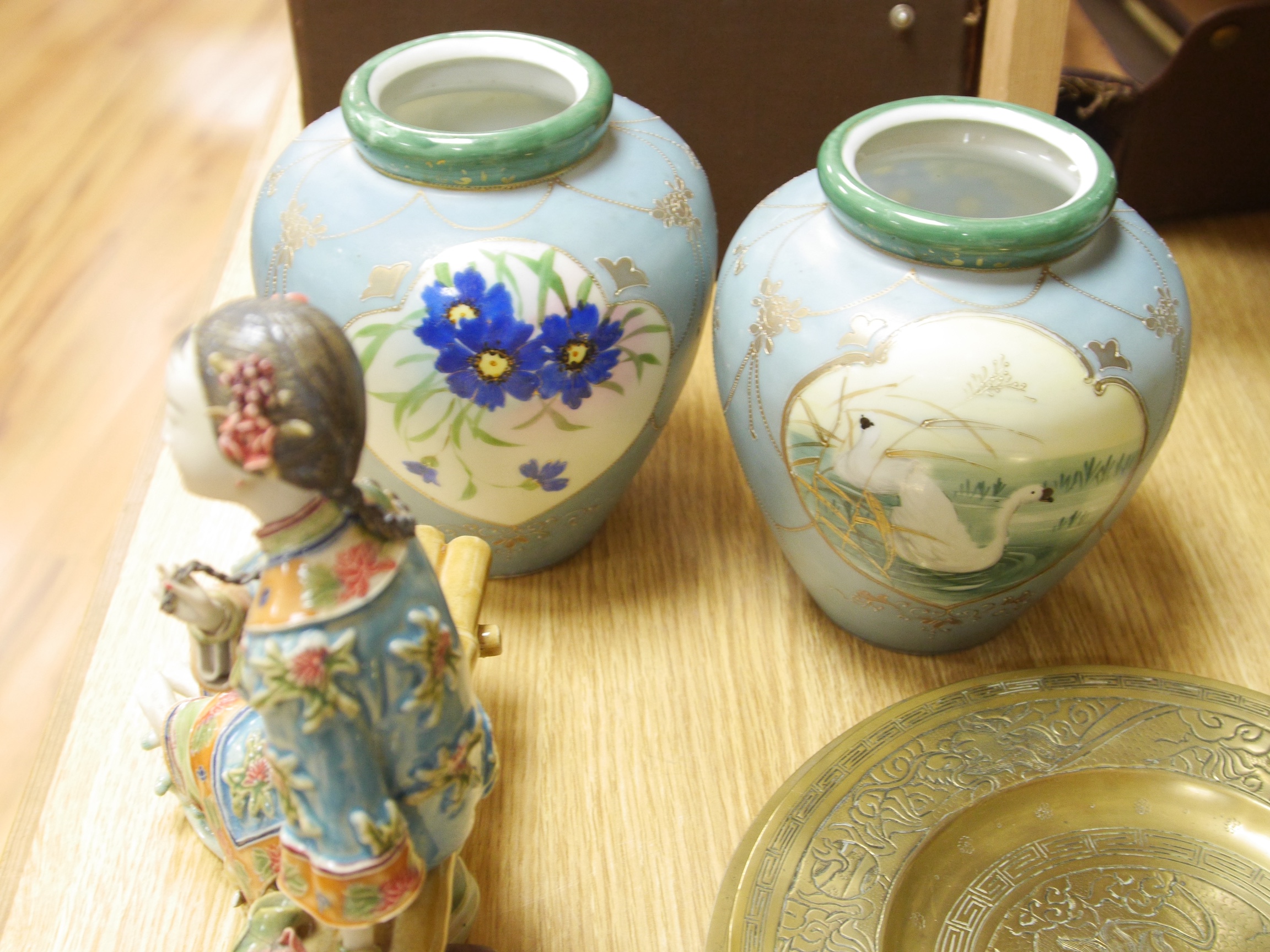 A large quantity of Chinese and Japanese ceramics and metalware to include Imari plates, blue and white vases and brass dishes, largest 37cm high. Condition - mostly fair to good